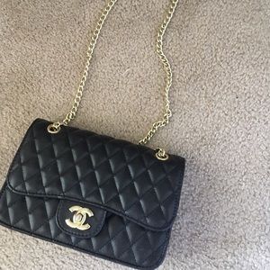 Cross body black quilted bag with gold chain